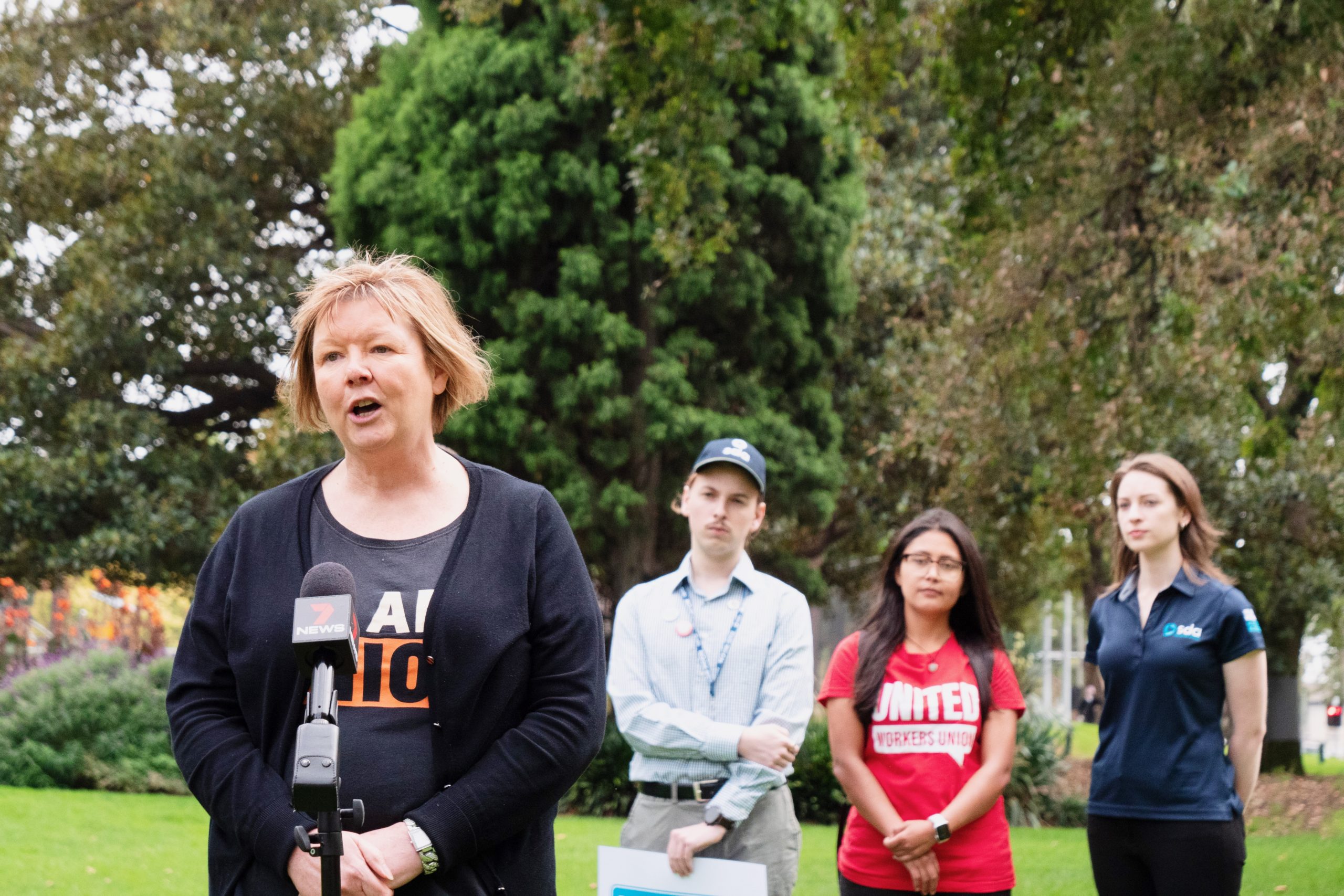 Workers speak at a press conference on the Annual Wage Review calling for a 5% increase in the national minimum wage and Award minimum wage. 